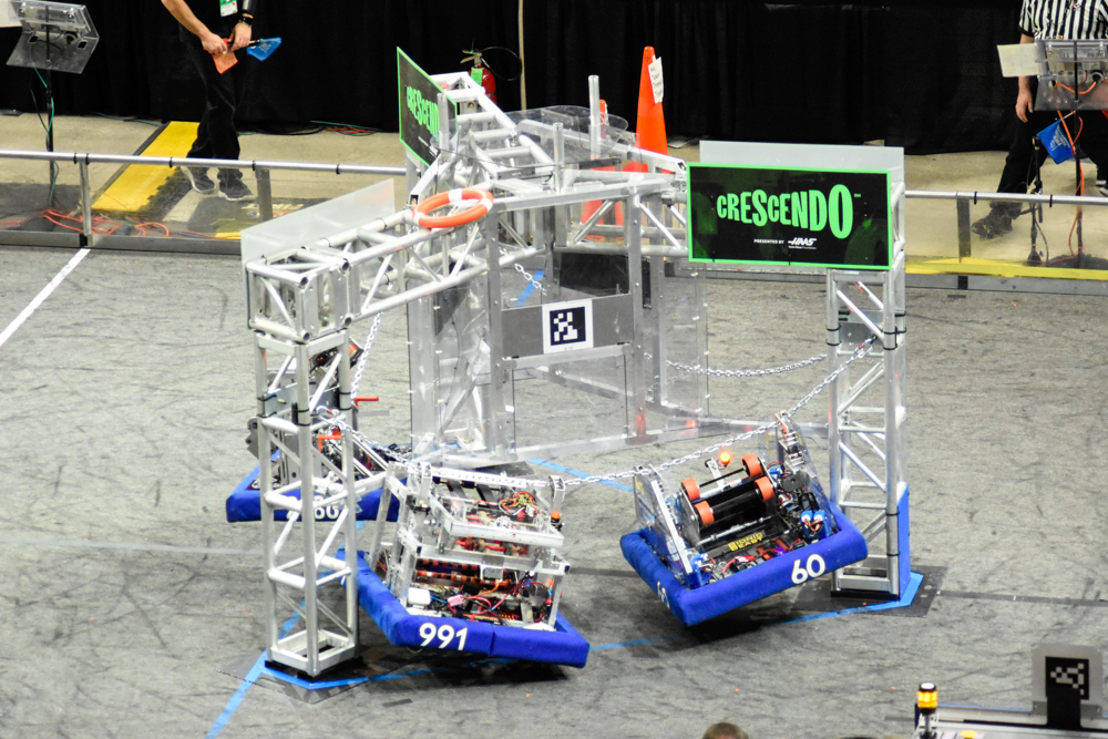 2024 robot scoring a ring into the goal