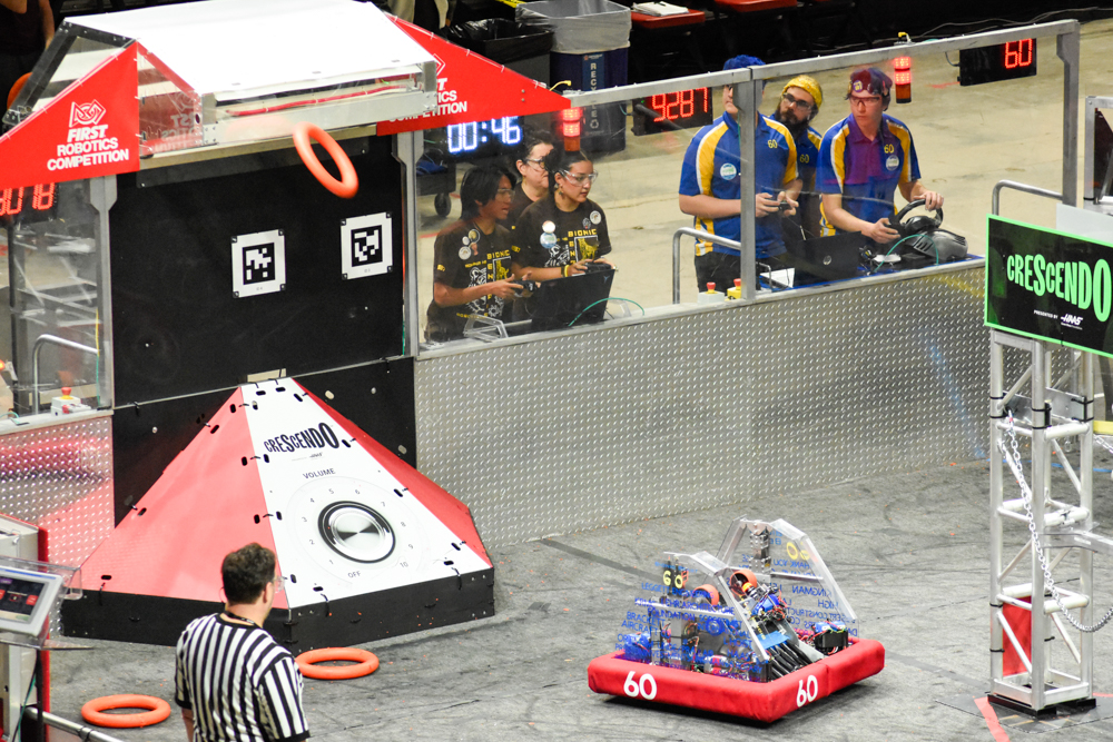 2024 robot scoring a ring into the goal