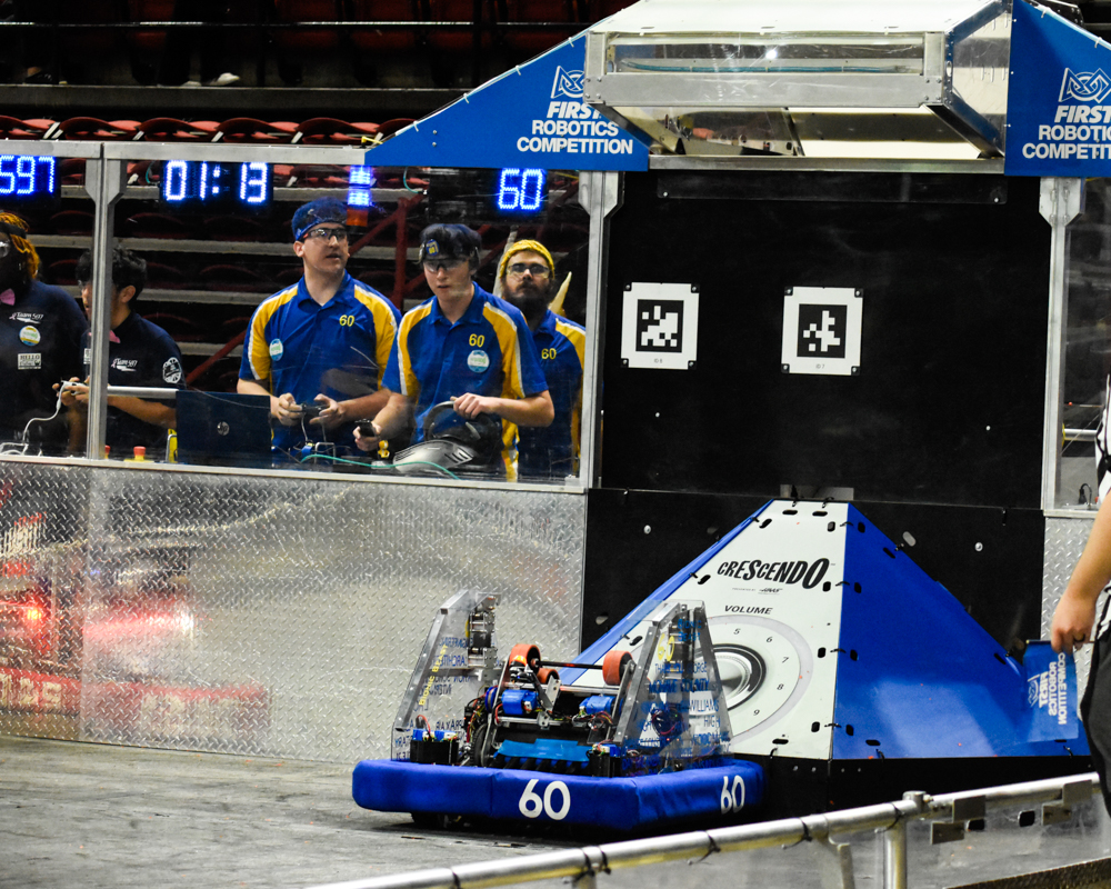 2024 robot scoring a ring into the goal